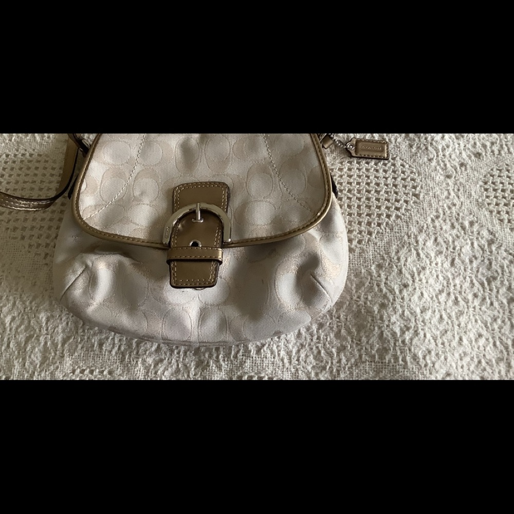 Coach light colored gold small crossbody purse